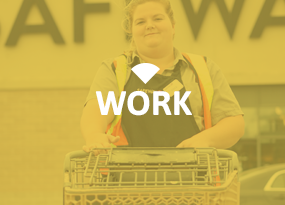 Woman at work pushing grocery cart