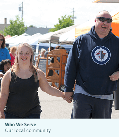 Man and woman walking at community fair